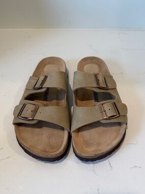 Women’s size 10 khaki colored cork sole sandals.
